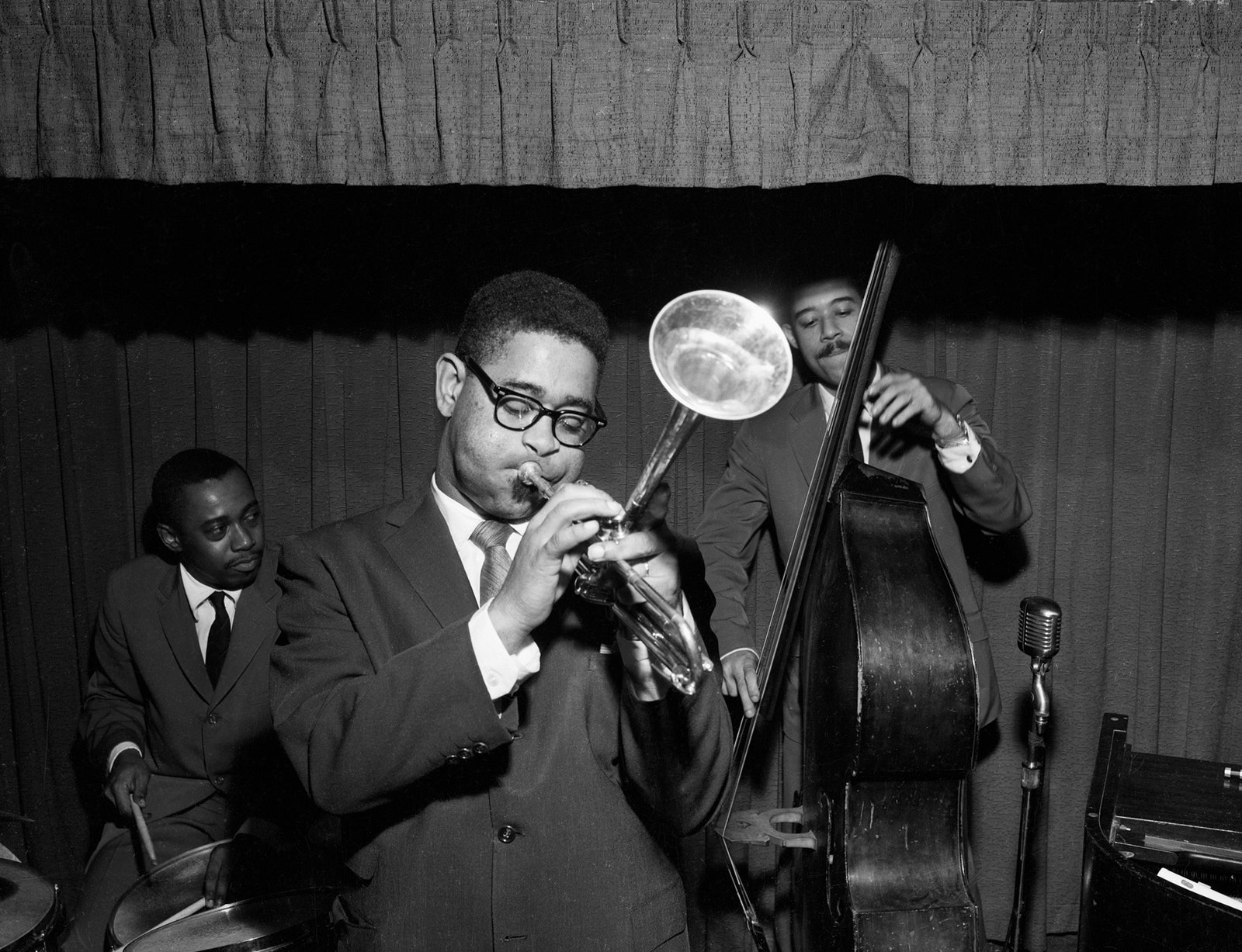 Image may contain Dizzy Gillespie Accessories Glasses Adult Person Formal Wear Tie and Musical Instrument