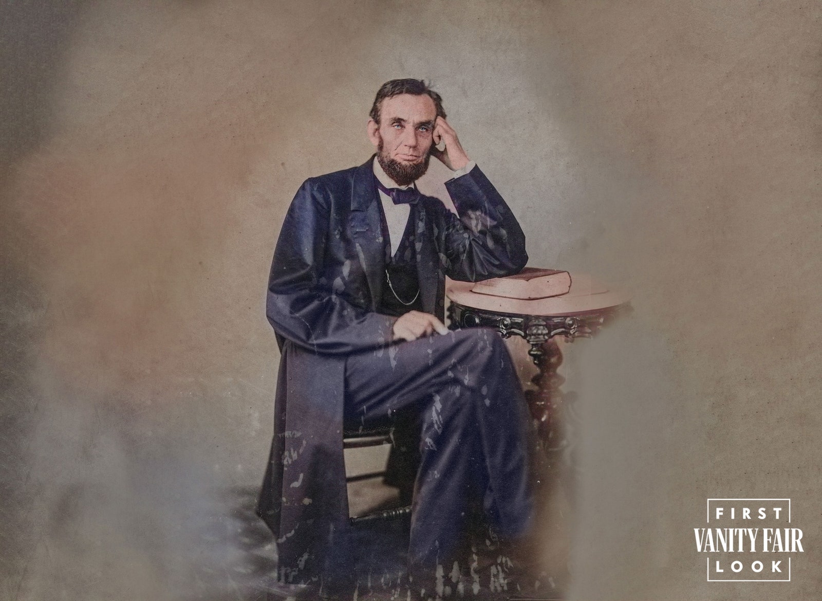 Image may contain Abraham Lincoln Clothing Coat Person Sitting Face Head Photography Portrait Formal Wear and Suit