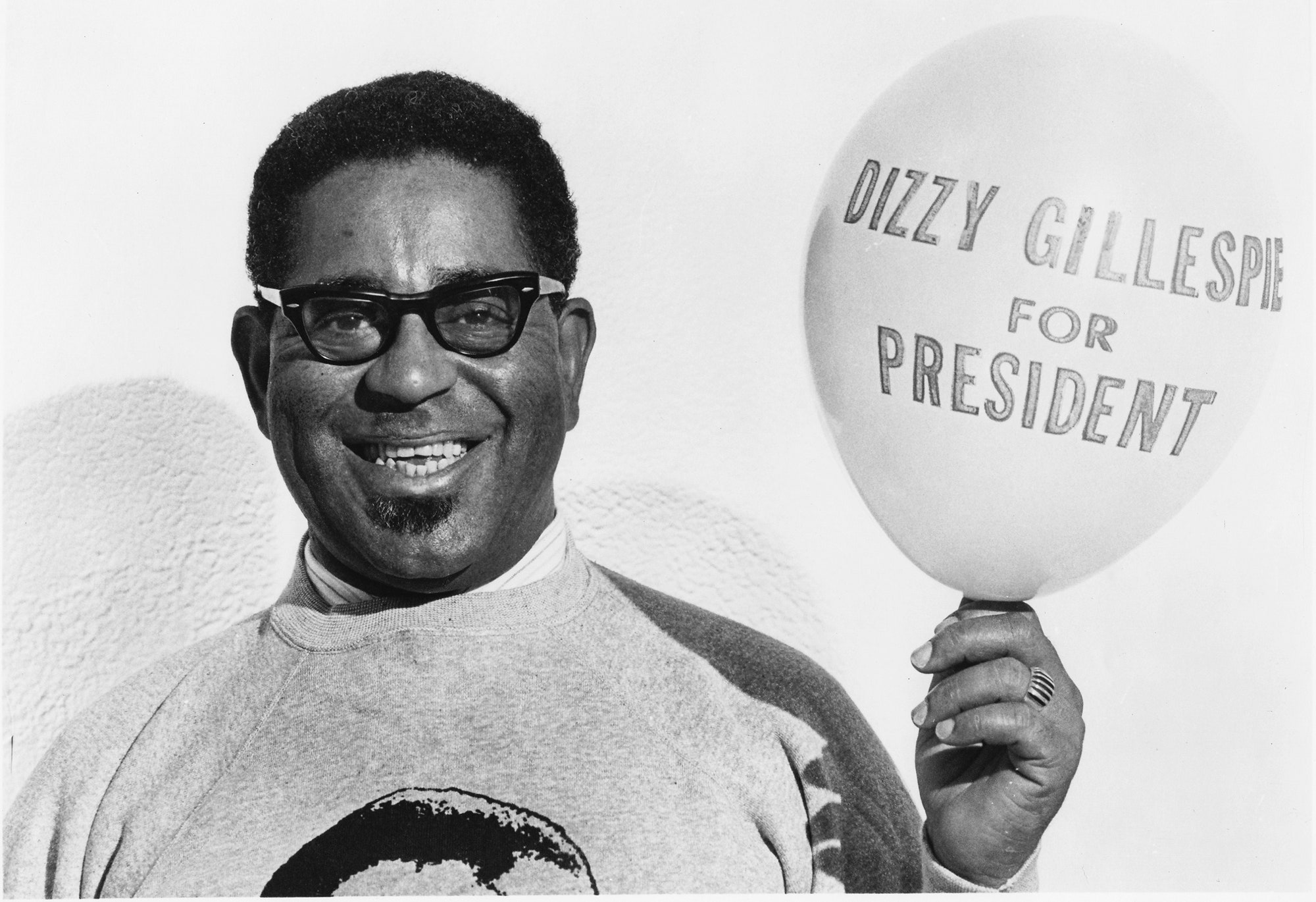 Image may contain Dizzy Gillespie Face Head Person Photography Portrait Clothing TShirt Happy and Smile